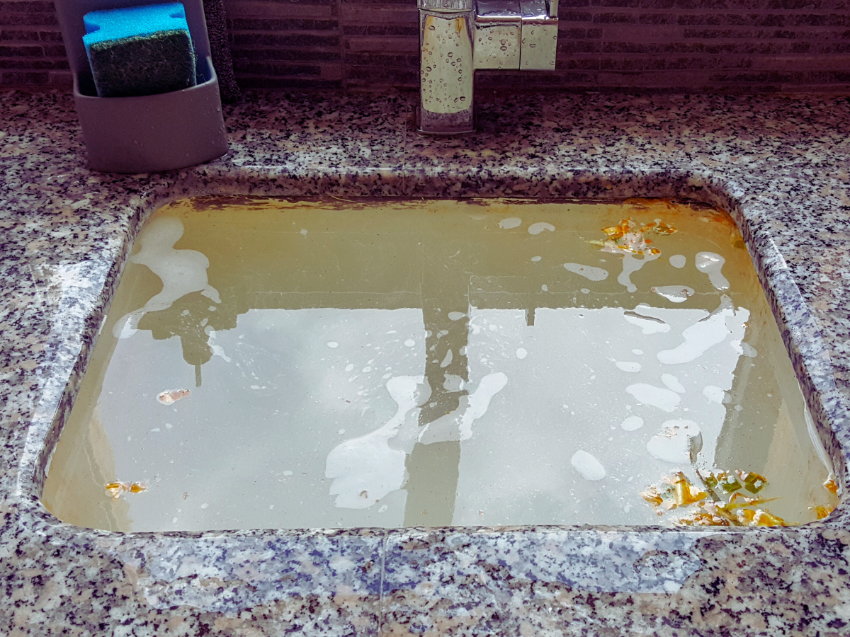 Dirty standing water in clogged sink