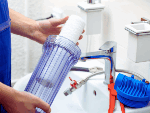 plumber installing new water filtration system